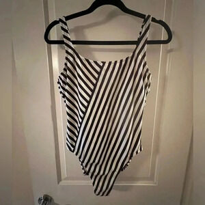 One-piece, fully lined, black and white striped swimsuit with low back…